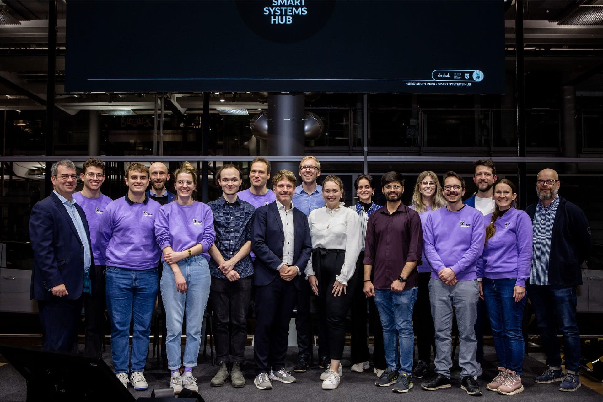 group picture of the smart systems hub team on a stage